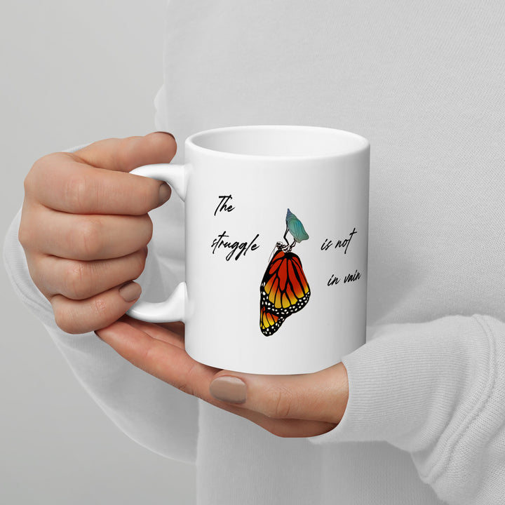 White glossy mug (The struggle is not in vain design)