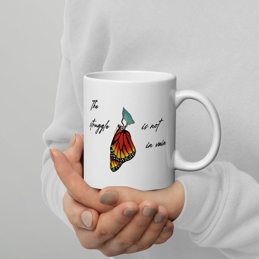 White glossy mug (The struggle is not in vain design)